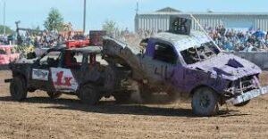 Two dirt cars having an accident inside a field